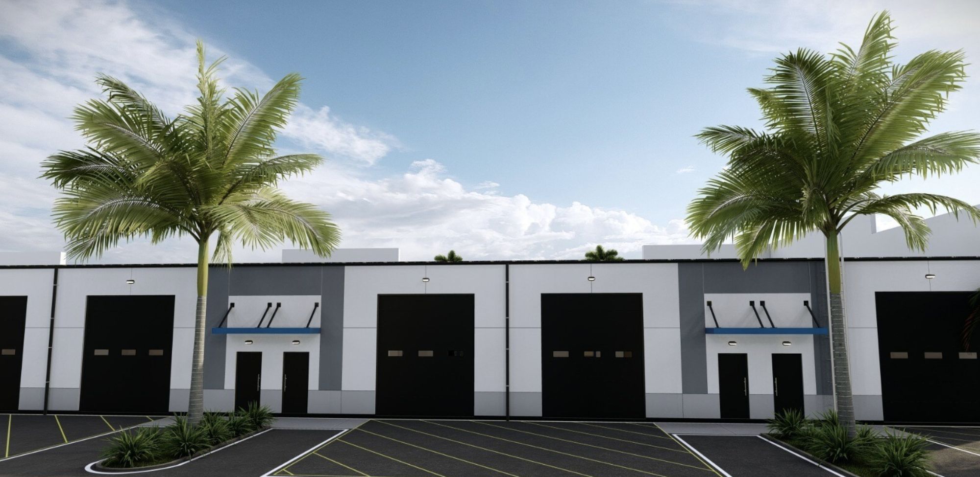 Loading side with black roll-up doors and personnel doors under awnings